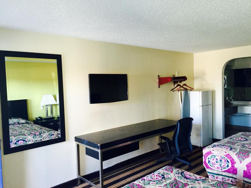 Executive Inn Groves Habitación foto