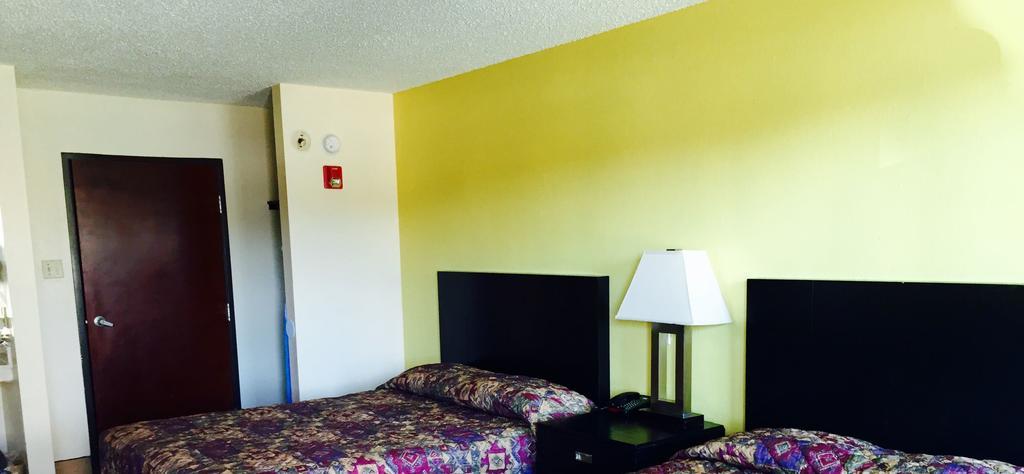 Executive Inn Groves Habitación foto
