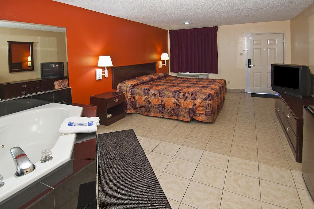 Executive Inn Groves Habitación foto