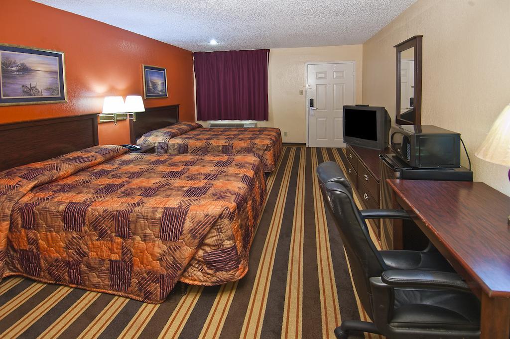 Executive Inn Groves Habitación foto